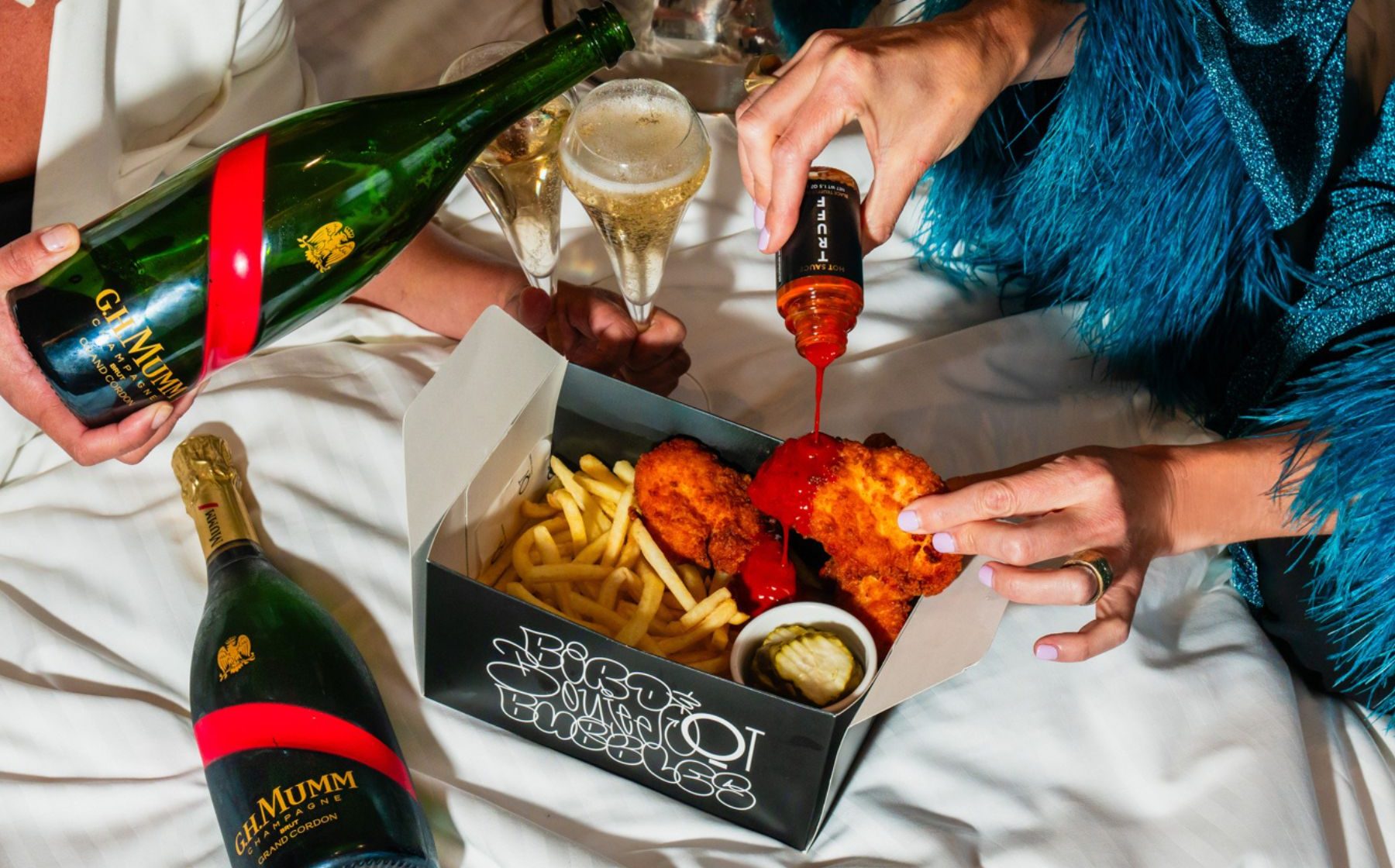 curated selection of snack attacks brimming with the finger-licking goodness of succulent Southern fried chicken pieces, on a bed on shoestring fries, with plenty of pickles, and series slather of gourmet, TRUFF Hot Sauce.